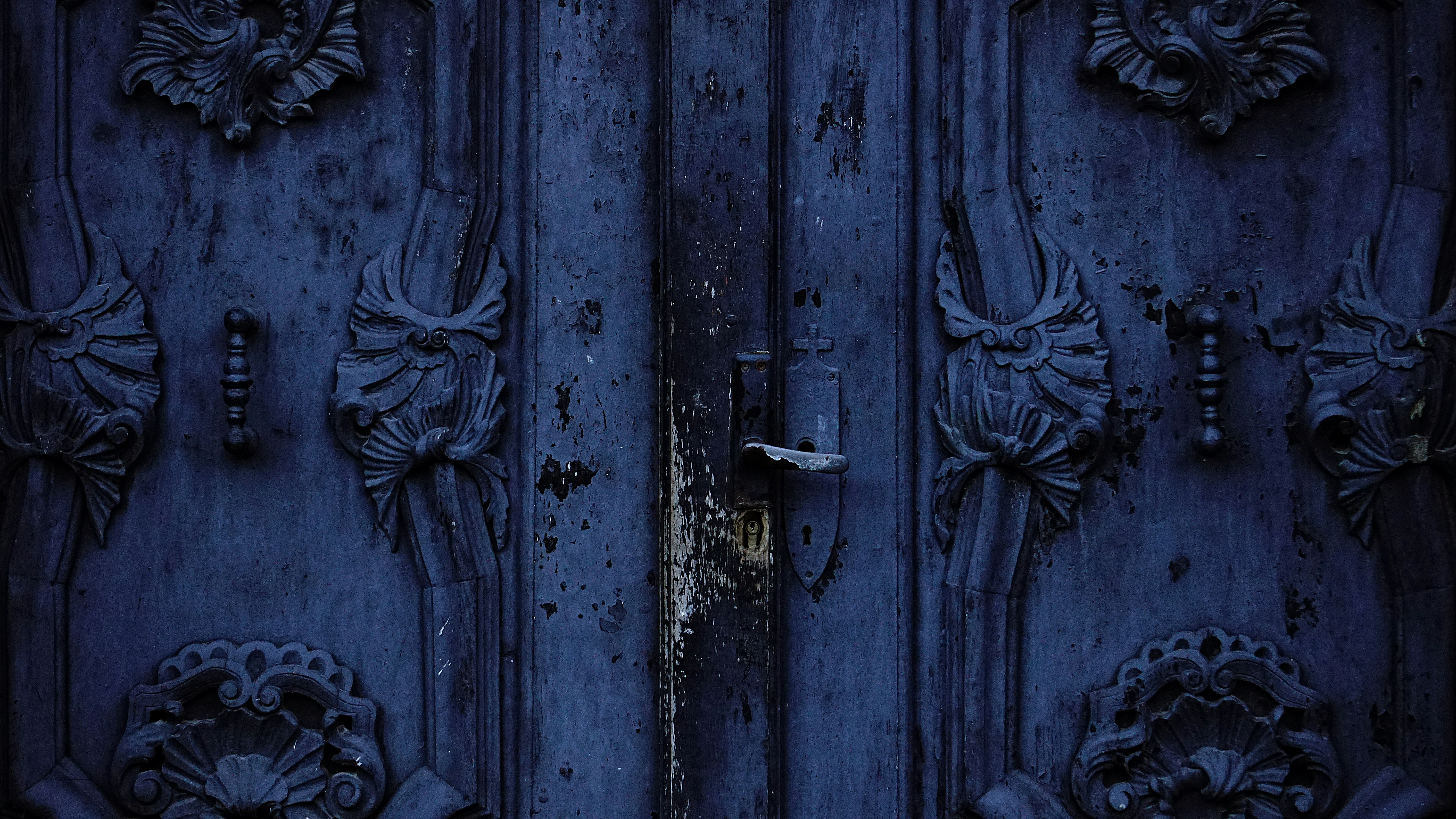 blue wooden ornate embossed door